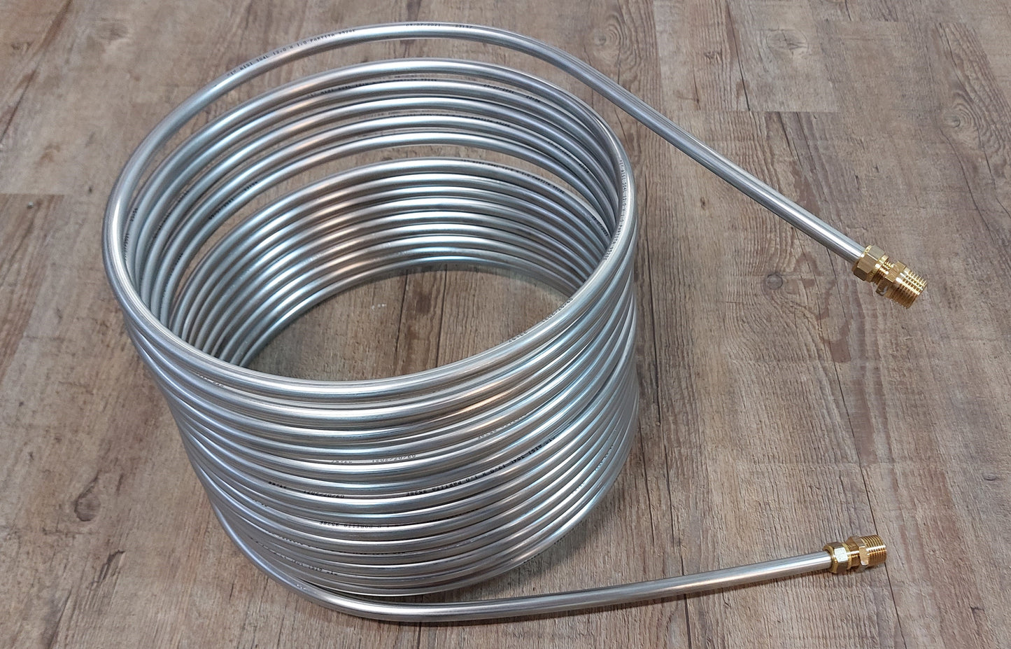 Spirale aus 15m Edelstahlrohr 12x1mm AISI 304L EN 1.4307 mit Außendurchm. ca. 32,5cm inkl. 1/2" AG Anschluss